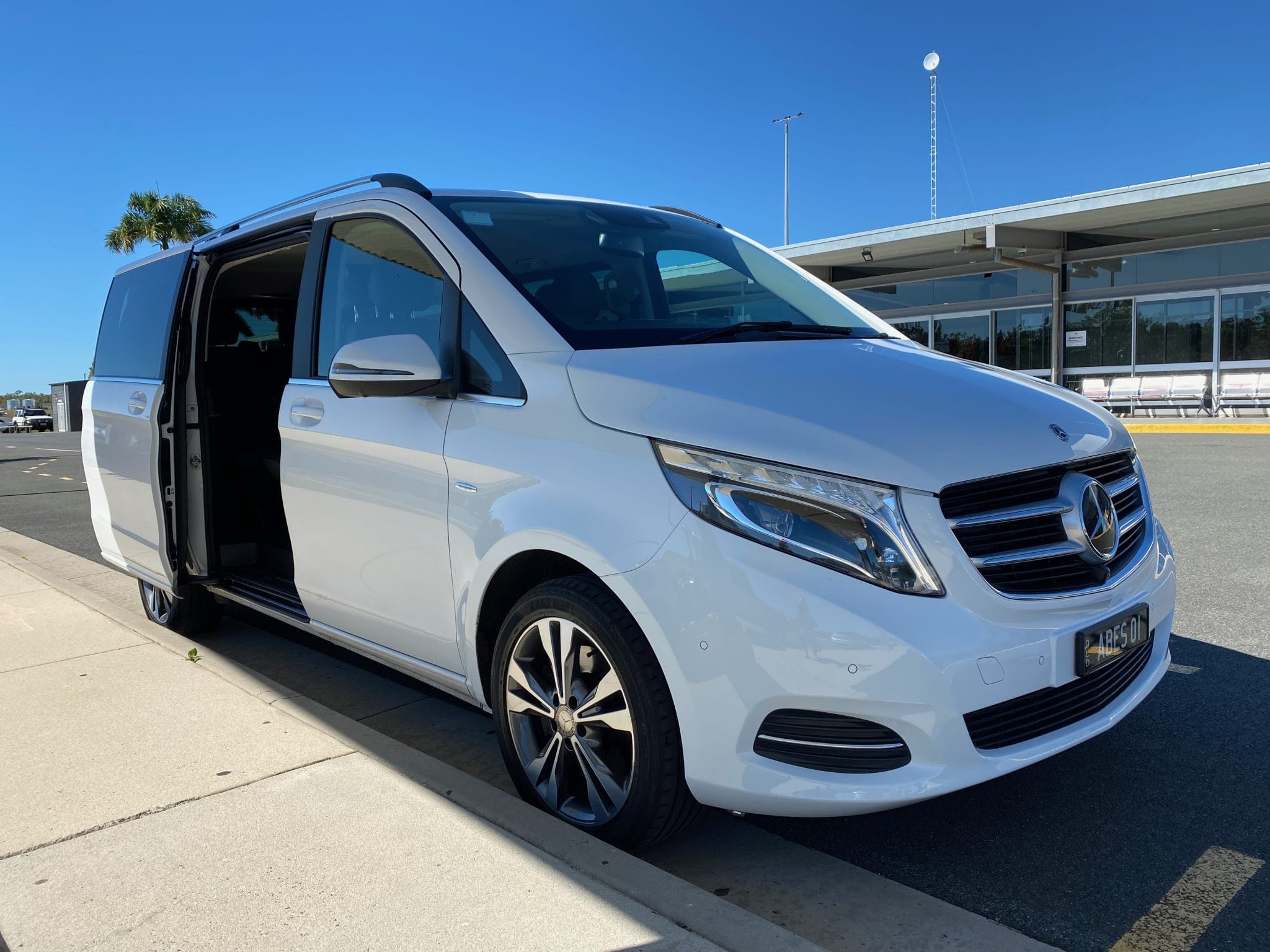 Mercedes V250 parked at airport with rear sliding door open