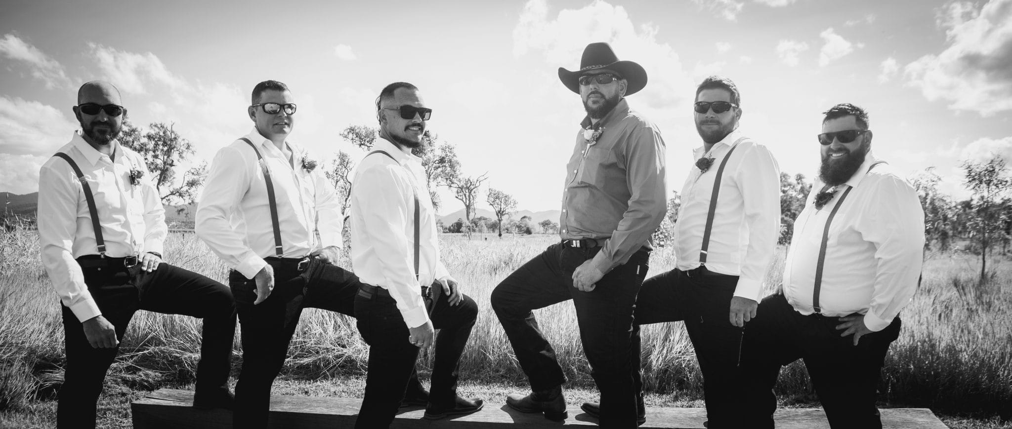 Groom and groomsman in a black and white photo