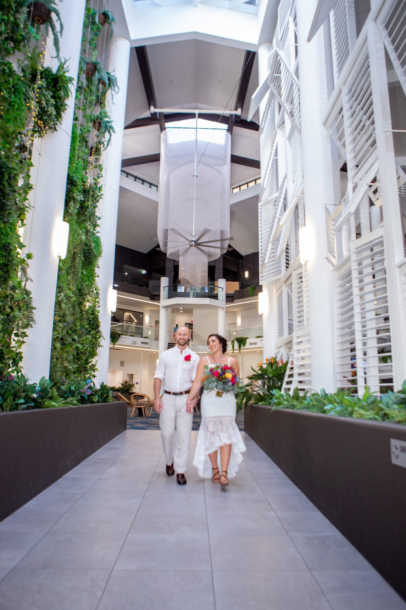 Bride and groom walking together on a path